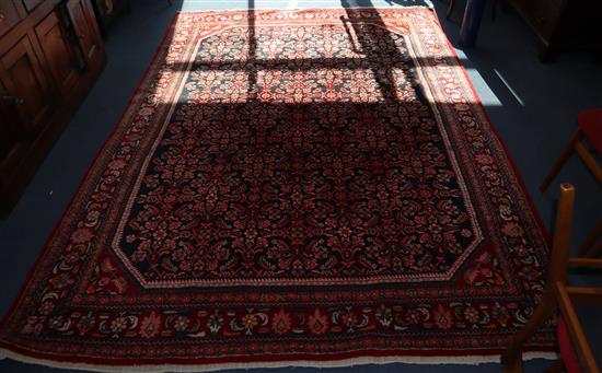 A Hamadan black ground small carpet 222 x 300cm